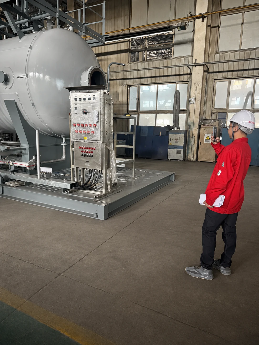 Engineer inspecting a process equipment control system